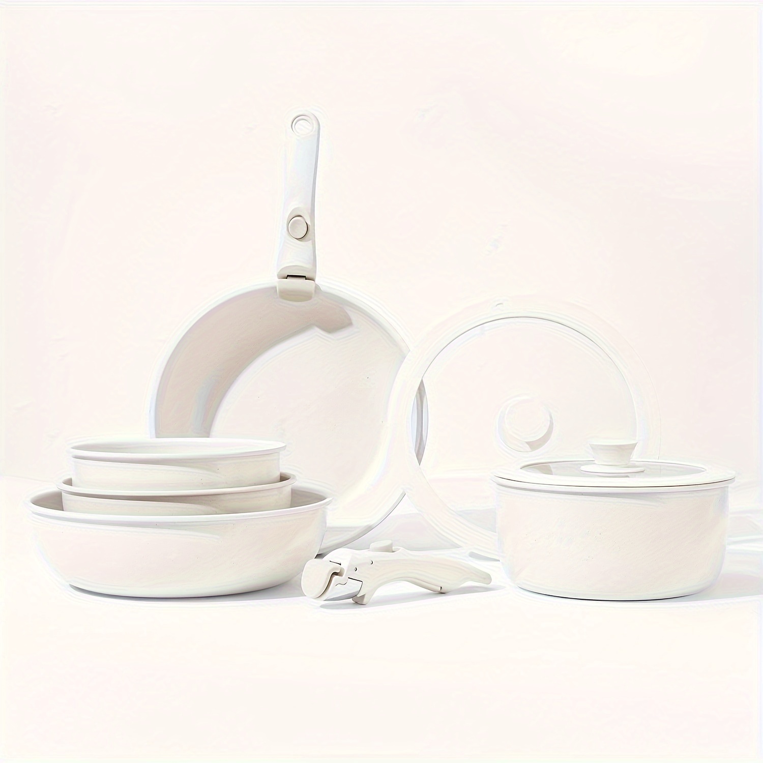 Conjunto de utensílios de cozinha elegante e prático com alça removível, ideal para uso doméstico e em restaurantes. Inclui panela antiaderente, frigideira, panela de sopa, panela de fundo plano e panela aninhada.